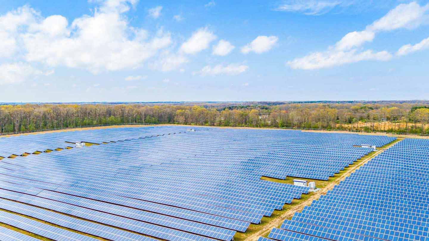 A wide shot of a large solar farm.