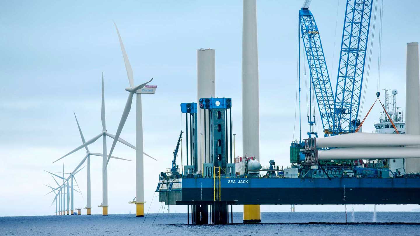 Wind turbines being installed at an offshore wind farm.