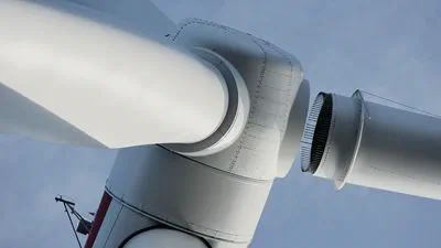 Close-up of the blades of an offshore wind turbine.
