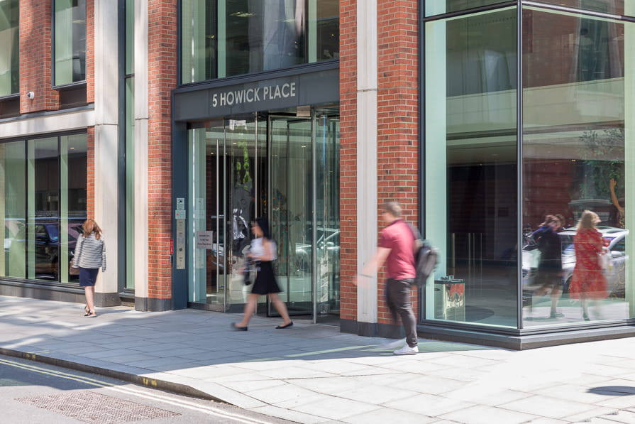 Pedestrians walking outside Ørsted's London office.