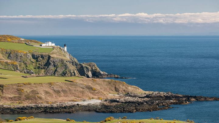 Isle of Man coastline with lighthouse on headland