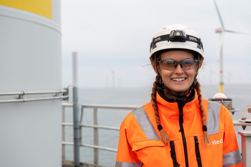 Female offshore wind technician on vessel