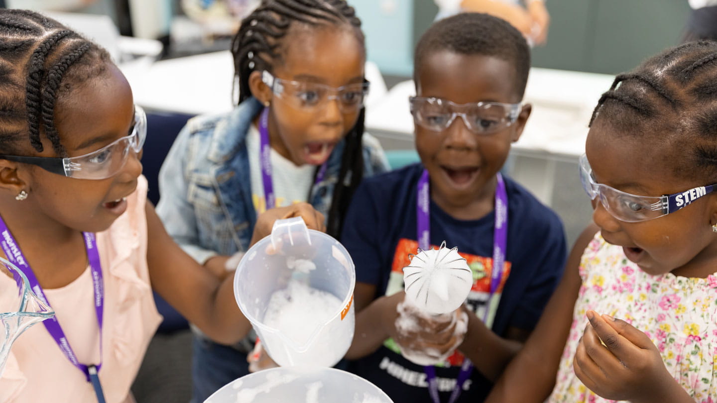 Image of excited children carrying out a Stemettes science experiment