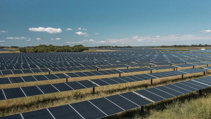 A field of black solar panels at one of Ørsted's solar and storage projects helping strengthen the U.S. electrical grid.